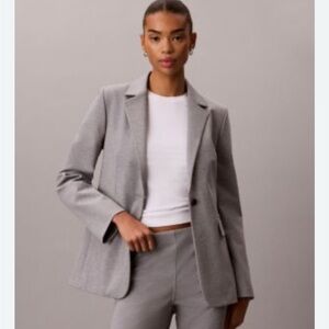 34.) Calvin Klein Women's Light Gray Blazer